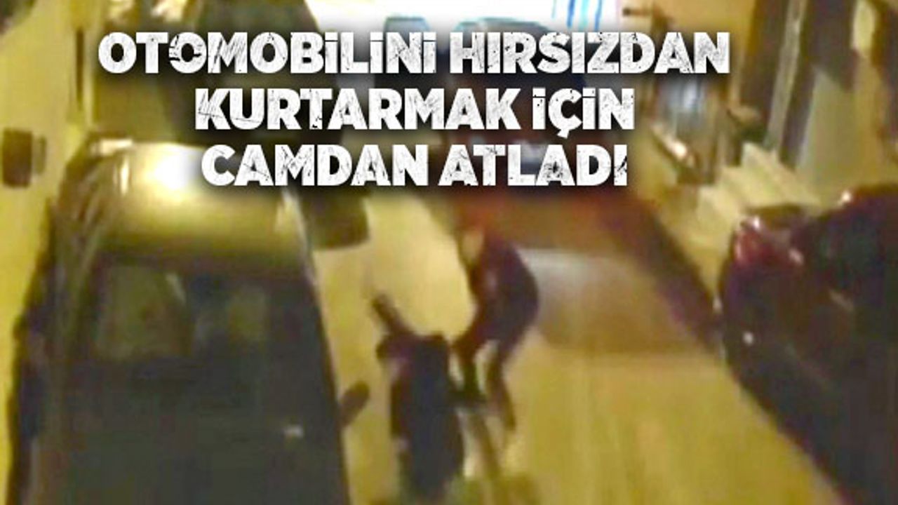 Camdan atlayıp otomobilini hırsızın elinden kurtardı