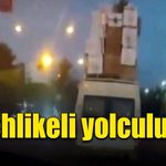 Eşyaları üst üste koyarak tehlikeli yolculuk yaptı!