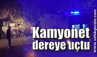 Hafriyat kamyonunun kapağı açılmayınca dereye uçtu