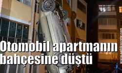 Freni boşalan otomobil apartmanın bahçesine düştü