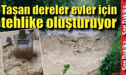 Taşan dereler evler için tehlike oluşturuyor