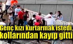 Genç kızı kurtarmak istedi, kollarından kayıp gitti