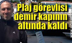 Kapuz Plaj görevlisi demir kapının altında kaldı