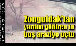 Zonguldak'tan yardım götüren  tır boş araziye uçtu