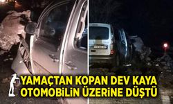 Yamaçtan kopan dev kaya otomobilin üzerine düştü