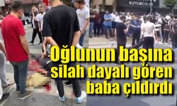 Oğlunun başına silah dayalı gören baba çıldırdı