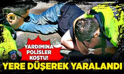 Yere düşerek yaralanan şahsın yardımına polisler koştu