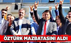 MHP  İl Başkanı Mustafa Öztürk mazbatasını aldı