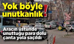 Yok böyle unutkanlık! Arabanın üzerinde unuttuğu  bir çanta dolusu para yola saçıldı