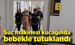 Suç makinesi kucağında bebekle tutuklandı