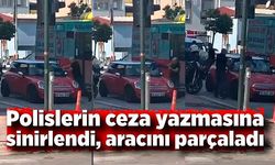 Polislerin ceza yazmasına sinirlendi, aracını parçaladı