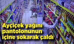 Ayçiçek yağını pantolonunun içine sokarak çaldı