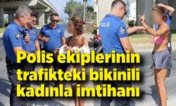 Polis ekiplerinin trafikteki bikinili genç kadınla imtihanı