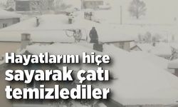 Hayatlarını hiçe sayarak çatı temizlediler