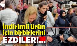 İndirimli ürün için birbirlerini ezdiler, yerlere düştüler