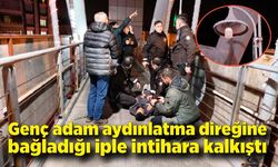 Aydınlatma direğine kendini asmaya kalkışan genci bekçiler kurtardı