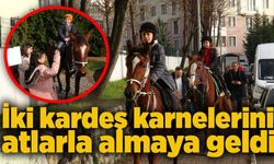 İki kardeş karnelerini atlarla almaya geldi