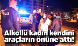 Kadın kendini araçların önüne attı