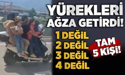 Motosiklete 5 kişi binen aile yürekleri ağza getirdi