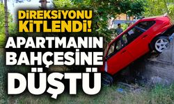 Direksiyonu kilitlenen otomobil apartman bahçesine düştü