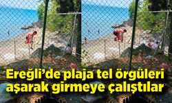 Plaja tel örgüleri aşarak girmeye çalıştılar