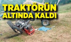 Tarlada devrilen traktörün altında kalan sürücü ağır yaralandı