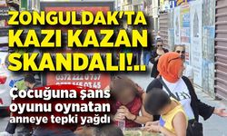 Küçük yaştaki çocuğuna şans oyunu oynatan anneye tepki yağdı