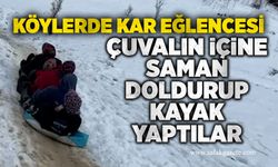 Köylerde kar eğlencesi: Çuvalın içine saman doldurup kayak yaptılar
