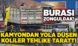 Seyir halindeki kamyondan yola düşen koliler tehlike tarattı