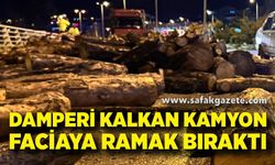 Kamyonun damperi aniden kalktı, odunlar yola döküldü