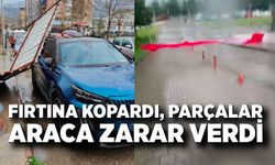 Fırtınanın etkisiyle yapıdan kopan parça araca zarar verdi