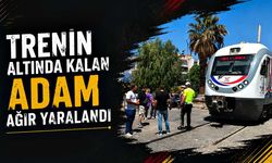 Trenin altında kalan adam ağır yaralandı