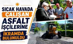 Sıcak havada çalışan asfalt işçilerine ikramda bulunuldu