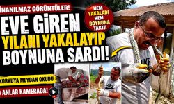 Eve giren yılanı yakalayıp boynuna sardı
