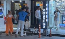 Caddede "Kafanı keserim" diyerek tehdit etti
