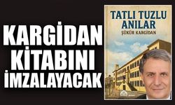 Kargidan kitabını imzalayacak