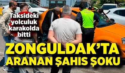 Aranan şahıs takside yolcu taşırken yakalandı