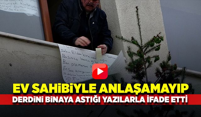 Derdini anlatmak için pencerelerine süreci anlattığı kağıtlar astı