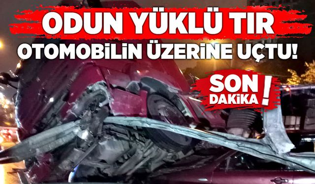 Odun yüklü TIR otomobilin üzerine uçtu!