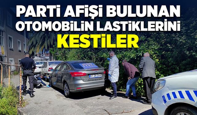 Parti afişi bulunan otomobilin lastikleri kesildi