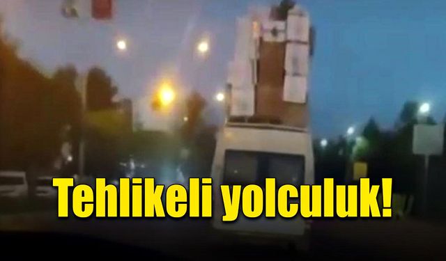 Eşyaları üst üste koyarak tehlikeli yolculuk yaptı!