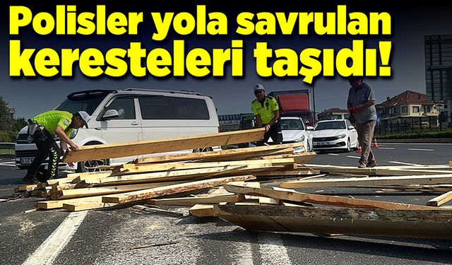 Polis ekipleri yola dökülen keresteleri taşıdı!