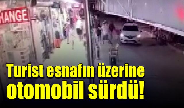 Turist esnafın üzerine otomobili sürdü!