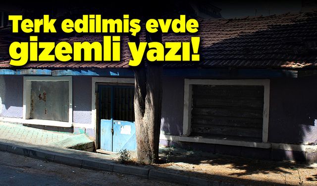 Terk edilen evin kapısına asılan yazı gizemini koruyor