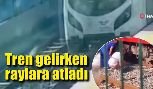 Tren gelirken raylara atladı