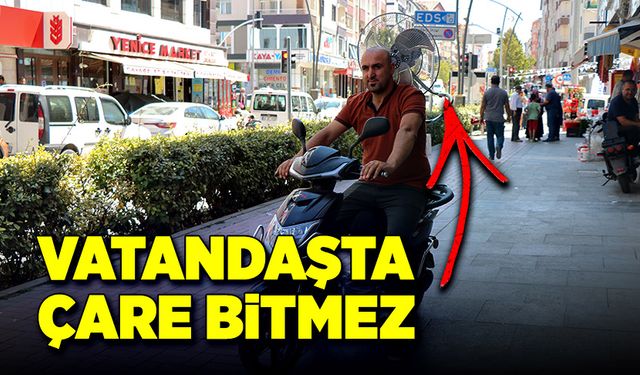 Sıcağa dayanamayan esnafın yöntemi güldürdü