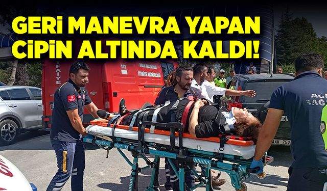 Geri manevra yapan otomobilin altında kaldı!