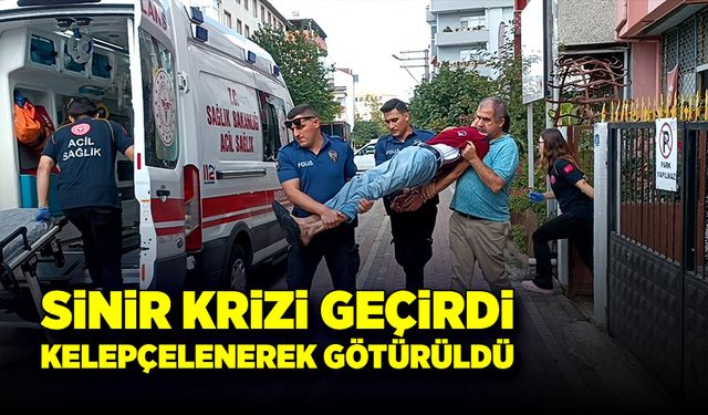 Sinir krizi geçirdi, kelepçelenerek ambulansa götürüldü