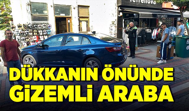 Dükkanın önünde gizemli araba