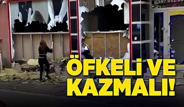 Öfkeli kadın, masaj salonuna kazmayla saldırdı!